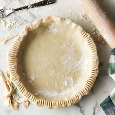 an uncooked pie sitting on top of a table