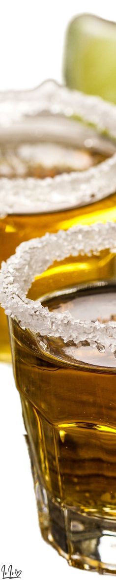 three glass dishes with yellow and green food items in the middle one on top of the other