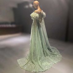 Luxurious Arabic Evening Party Dress with Feather Embellishments and – Larosabride Green Feather Dress, Feather Evening Gown, Feather Cape, Empire Silhouette, Green Feather, Red Carpet Gowns, Dress Drawing, Full Dress, Evening Dress Fashion