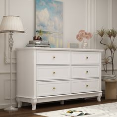 Our 6-drawer dresser is the perfect solution to save space and store scattered and small gadgets. Its delicate design with accent appearance gives color to your life. Crafted with high-quality particle board, durable and non-toxic for your daily use. It features 6 spacious drawers that open smoothly, revealing ample space to tuck away spare linens, shirts, pants, and other wardrobe must-haves. The top leaves plenty of room to turn it into a vanity and add a mirror, or display a table lamp and some framed photos. FUFU&GAGA Contemporary White Double Dresser with 6 Drawers, Modern Design, Wide Drawers, Sturdy Construction, Composite Material | LJY-CX0032-02 Dresser Decor Bedroom, Dresser Wood, White Chest Of Drawers, 7 Drawer Dresser, 9 Drawer Dresser, Chest Dresser, White Chests, Wood Dresser, Double Dresser