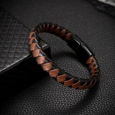 New Stylish Fashion Brown And Black Braided Leather Bracelet, Metal Magnetic Buckle Bracelet For Men. Perfect For Men Who Love Edgy And Trendy Accessories. High-Quality Material: Made Of Premium Leather And Metal, This Bracelet Is Durable And Comfortable To Wear. Easy To Wear: The Magnetic Buckle Makes It Easy To Put On And Take Off The Bracelet. Versatile: This Bracelet Is Suitable For Various Occasions, Such As Parties, Concerts, And Daily Wear. Great Gift Idea: This Bracelet Is A Perfect Gift Elegant Brown Leather Braided Bracelets, Elegant Brown Leather Braided Bracelet, Brown Leather Bracelet With Wrist Strap, Brown Leather Braided Bracelet As Gift, Brown Leather Braided Bracelet, Brown Braided Leather Bracelets, Everyday Brown Bracelet, Brown Leather Bracelet With Wrist Strap For Everyday, Everyday Brown Bracelets With Black Band