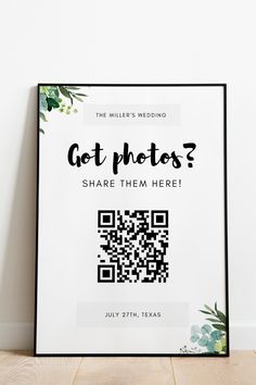 a white poster with the words got photos? share them here on it next to a plant