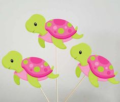 three little turtle cupcake toppers on sticks