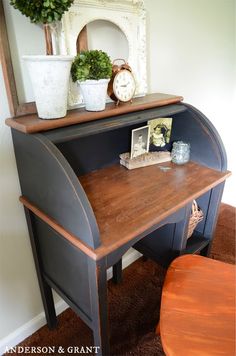 an old desk with some plants on top