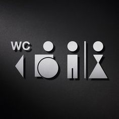 the word w c is made up of cut out shapes and letters on a black background