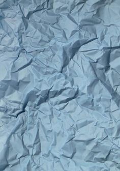 crumpled blue paper is shown as if it was made out of something or other material