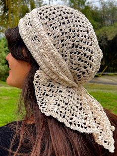 a woman wearing a white crochet hat