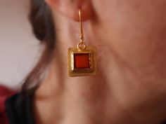 Brown orange carnelian gemstone dangle earrings. Square carnelian stone has been set in gold plated fine silver bezel, other parts are gold plated sterling silver ( Gold Vermeil ). I hand create it by using silver metalsmith techniques. Dangling, comfortable and beautiful! Measurements; approx. 19 mm / 0.74 inch in square I ship inside a gift box. I have got also it's ring as you can see in the last photo and below listing. https://www.etsy.com/listing/165123385/goldvermeilcarnelianringasymmetri Gold Brass Earrings With Cabochon Detail, Gold Brass Cabochon Earrings, Gold Cabochon Brass Earrings, Carnelian Amber Earrings For Gift, Amber Carnelian Gemstone Earrings, Amber Carnelian Earrings Gift, Gold Carnelian Dangle Earrings, Gold Carnelian Gemstone Earrings, Gold Carnelian Jewelry With Matching Earrings