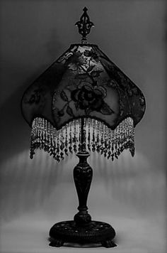 a black and white photo of a table lamp