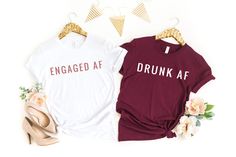 two t - shirts with the words brew before you're drunk on them next to some shoes and flowers