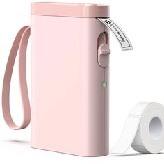 a pink portable toilet paper dispenser next to a roll of toilet paper