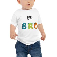 Help your kiddo celebrate his new brother or sister (or even pet!) with a dino BIG BRO tshirt! It's never too early to look great! So get your baby this short sleeve cotton jersey tee that's not only stylish, but also comfy, durable, and easy to clean. It's a classic that's bound to become the most loved item in your baby's wardrobe.  * 100% combed ring-spun cotton * Heather colors are 52% combed ring-spun cotton, 48% polyester * Fabric weight: 4.2 oz/yd² (142 g/m²) * Pre-shrunk fabric * 32 singles * Relaxed fit * Side-seamed construction * Blank product sourced from Nicaragua, the US, or Honduras This product is made especially for you as soon as you place an order, which is why it takes us a bit longer to deliver it to you. Making products on demand instead of in bulk helps reduce overpr Fun Short Sleeve T-shirt With Dinosaur Print, Fun Short Sleeve Dinosaur Print T-shirt, Dinosaur Print Short Sleeve T-shirt For Birthday, Birthday Dinosaur Print Short Sleeve T-shirt, Birthday T-shirt With Dinosaur Print, Funny Dinosaur Print Short Sleeve T-shirt, Jersey Tee, Kids Tops, Nicaragua