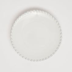 a white plate topped with lots of pearls