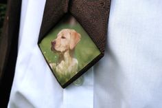 a man wearing a brown tie with a dog on it's neck and a white shirt