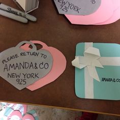 two pieces of paper that say return to amanda & co new york, and another piece with a heart on it