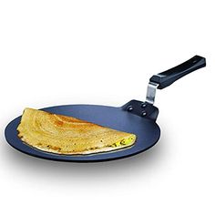 an omelet on a blue plate with a black handle