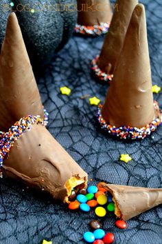 chocolate cones with candy in them on a table