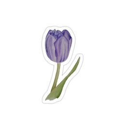 a purple flower sticker sitting on top of a white surface