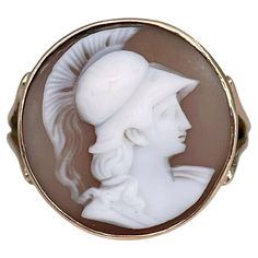 This is a Victorian signet ring crafted in 15K gold. Circa 1890. The piece features a shell cameo depicting a warrior facing right. Signed "15ct” Weight: 3.59g Size: 17.25 (US 7) IMPORTANT: please ask about the possibility to resize before purchase. As a buyer, you are fully responsible for the customs duties, other local taxes and any administrative procedures related to imports into the country of destination. ——— If you have any questions, please feel free to ask. We describe our items accura Brooch Display, David Webb, Cameo Jewelry, Cameo Ring, Vintage Cameo, Antique Brooches, Carved Shell, Cameo Brooch, Cameo Pendant