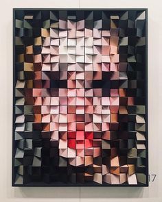 a painting made up of cubes with a man's face in the middle