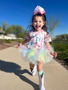 This tutu contains a mixture of pastels to create an extra sweet look. Playful Summer Tutu Dress With Tulle Skirt, Playful Spring Tutu Dress For Party, Playful Spring Party Tutu Dress, Spring Party Playful Tutu Dress, Playful Tulle Tutu Dress For Playtime, Spring Playtime Tulle Tutu Dress, Spring Tulle Tutu Dress For Playtime, Fun Spring Party Tutu Dress, Spring Party Fun Tutu Dress