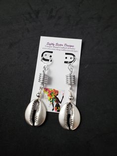 "Beautiful handmade earrings made with large metal cowrie shells, aluminum wire and metal beads. Lightweight and easy to wear, these dangle earrings are 3\" long with silver plated leverback earwires. Please come back and visit to check for more unique new designs and styles For more styles visit my Etsy shop:www.etsy.com/shop/SoftlySisterDesigns" Unique Silver Metal Beaded Earrings, Beaded Metal Drop Earrings For Beach, Metal Beaded Drop Earrings For Beach, Handmade Adjustable Metal Clip-on Earrings, Nickel Free Silver Beaded Earrings For Beach, Adjustable Metal Earrings For Beach, Nickel-free Silver Beaded Earrings For Beach, Bohemian Adjustable Metal Wrap Earrings, Adjustable Bohemian Metal Wrap Earrings