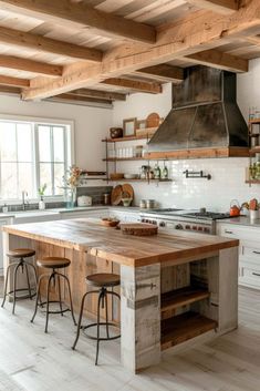 a kitchen with an island made out of wooden planks