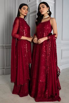 Embellished Red Pakistani Dress with Gharara is a breathtaking and stunning Pakistani Fancy Dress with luxurious decorations on it. This dress with lavish floral patterns makes this Pakistani Dress a must-buy product if you are looking for Pakistani Wedding Party Dresses. Kameez: This Red Pakistani Dress comes with a beautiful kameez in premium quality chiffon. This kameez is beautifully decorated with fine embroidery work accompanied by iridescent sequins. Furthermore, beautiful artistry on the Red Pakistani Dress, Embroidered Sharara, Raw Silk Fabric, Pakistani Designer Suits, Chiffon Sleeves, Pakistani Fancy Dresses, Chiffon Collection, Embroidered Chiffon, Pakistani Dress