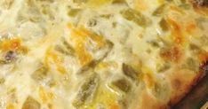 a cheesy casserole with cheese and green peppers