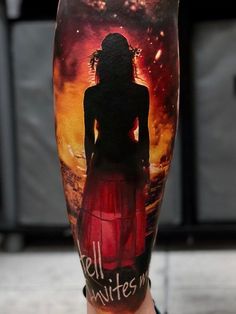 a man's leg with an image of a woman in red dress on it