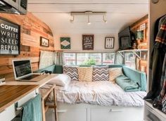 the interior of a tiny home with wood walls and white flooring is decorated in blue and green