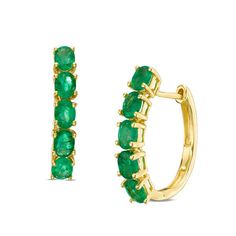 Ready to take her look to the next level with ease, these fabulous gemstone hoop earrings are simply perfect. Crafted in warm 14K gold, each oval-shaped hoop is lined along the front edge with five dazzling 4.0 x 3.0mm oval-shaped verdant-green emeralds. Buffed to a brilliant luster and sure to please, these dainty earrings secure with hinged backs. 14k Gold Oval Huggie Earrings Fine Jewelry, Fine Jewelry Oval Huggie Earrings With Prong Setting, Oval Huggie Earrings Fine Jewelry, Yellow Gold Oval Huggie Earrings Fine Jewelry, Elegant Oval Hoop Earrings With Gemstone, Classic Yellow Gold Hoop Earrings With Gemstone, Zales Zales, Stone Hoop Earrings, Gem Drop Earrings