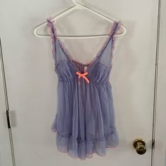 Nwt Lavender Short Negligee With Open Back Ruffled Coral Trim And Satin Ribbon Lace Sheer Adjustable Straps Elasticized Under Bustling Tag States This Is Two Items, But I Do Not Have The Matching Panties Measurements Are Not Guaranteed. Length Is Measured From Center Of Back Neck Chest 13 1/2" Length 15" Keyword: Lace, Sexy, Romantic, Romance, Honeymoon Trending Cute Pajama Sets, Cute Lingerie, Cute Pajamas, Pajama Sets, Ribbon Colors, Relationship Tips, Orange And Purple, Satin Ribbon, Night Gown