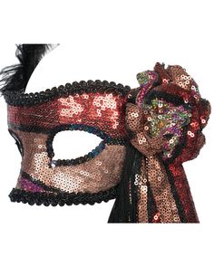 This mask has been hand decorated with red, gold and black sequin fabric, black trimming and black feathers. Details: Includes trimmings around outer edge and black sequins around the eye. There is a ruched flower shaped appliqué, a drape of fabric and black tassels with tiny red crystals hanging down on one side of the mask. On the other side are two black feathers. Holds with Elastic around the back. Fabrication: card mask, sequin fabric, fringing, crystal, elastic Condition: In very good pre- Black Sequin Fabric, Crystals Hanging, Sequin Mask, Costume Masks, Costume Mask, Fabric Black, Black Feathers, Sequin Fabric, Red Crystals