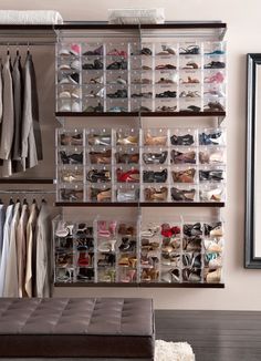 the closet is organized with clear bins for shoes and other items to be stored in