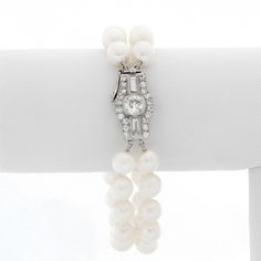 Double Strand Pearl Bracelet With Diamonds - Art deco style bracelet with 2 strands of pearls and an oversized diamond clasp. Bracelet measures approx. 6 1/2 inches with approx. 1 ct of diamonds. Pre-Owned . Luxury Double Strand Jewelry With Adjustable Chain, Luxury Double Strand Pearl Jewelry, Classic White Gold Diamond Pearl Bracelet, Classic Diamond Pearl Bracelet For Formal Occasions, Elegant Diamond Jewelry With Box Clasp, Classic White Evening Bracelets, Formal Diamond Pearl Bracelet With Jubilee Style, Formal Round Diamond Pearl Bracelet, Bracelet With Diamonds