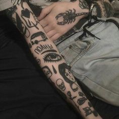 a person with tattoos on their arms and legs