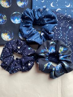 FREE UK DELIVERY for orders over £20GBP with the code FREEDELIVERY. Discount applied when code entered at checkout. An awesome gift for space and galaxy lovers. Striking patterns that are sure to add sparkle to any outfit. Ideal for any space/science lovers. High quality hand made scrunchies. Lots of fabric for a full look in the hair even when the elastic is pulled taut, and strong, wide elastic for hold and comfort. Each scrunchie is sold separately unless stated differently. Approx. 3in diameter and 2in wide to wrap around the hair twice for maximum hold with style, without snapping!  Handmade to order in Sheffield, UK. We are a new business looking to branch out into more lines in the future, aiming to use remnant fabrics that may otherwise go to waste. Dispatch is aimed to be within 1 Space And Galaxy, Space Gifts, Galaxy Gifts, Celestial Gifts, Sheffield Uk, Granddaughter Birthday, Space Gift, Science Gifts, Hair Collection