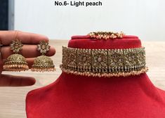 *Light weight gold choker necklace Set with earrings Tikka as shown in the pic. * Studded with crystals and rhinestones. * One of a Kind. *Necklace Width- 1.7 inches(included drops) * Earrings Length: 2.5 inches(included drops) *Earrings width- 1.2 inches Adjustable Gold Kundan Necklace For Party, Gold Kundan Choker Necklace As A Gift, Heavy Gold Choker As Gift, Gold Choker With Hand Set Details For Festivals, Gold Choker Jewelry Sets For Celebration, Heavy Gold Bridal Necklace For Party, Adjustable Gold Kundan Necklace For Celebration, Gold Hand Set Choker For Festivals, Heavy Gold Jewelry Sets For Party