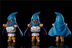 three figurines are shown in different poses on a black background, one is wearing a blue cape and the other has a white shirt