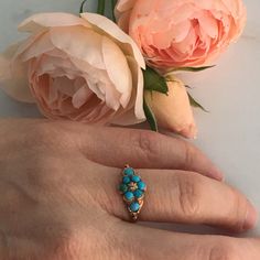 Details: Sweet European made Victorian cluster turquoise ring believed to be circa 1855-1875's. A very beautiful ring with 14K rose gold and turquoise. This piece is so sweet. The band measures 9mm at the widest point. Please ask all necessary questions prior to placing an order. Measurements: The size is 6 1/4 US and can be sized for a fee. Condition: The overall all condition of this ring is very good. The stone is a beautiful color and securely set. Rose Gold And Turquoise, Gold Turquoise Ring, Filigree Ring Gold, Turquoise Gold Ring, 14k Rose Gold Ring, Gold Engraving, Gold Filigree, Lovely Ring, Filigree Ring