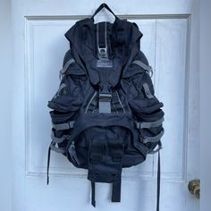 a back pack hanging on a door handle