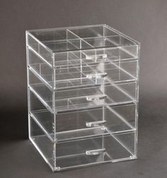 the clear drawers are stacked on top of each other and have five compartments for storage