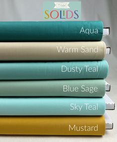 four different colored sheets stacked on top of each other with the words aqua, warm sand, dusty teal, blue sage and sky teal