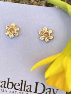 A pair of solid gold tiny daffodil earrings, beautiful little miniature studs cast from an original hand carved Victorian flower design.  The earrings are perfect for that Spring feeling after a long winter, very floral, fitting the botanical trend at the moment. Tiny floral studs are all the rage.Perfect for every day wear, the studs have lovely hand crafted solid posts and backs and every single one is handmade in my Devon studio.These little English country garden daffodils are really sweet, Yellow Gold Flower Earrings For Gift, Yellow Gold Flower Earrings As Gift, Gold Flower Earrings With 3d Flowers, Yellow Gold Birth Flower Earrings Gift, Delicate Tiny Flower Earrings For Gift, Yellow Gold Hallmarked Flower Earrings For Gift, Yellow Gold Birth Flower Earrings, Tiny Flower-shaped Earrings For Gift, Tiny Flower Earrings As A Gift