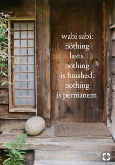 a wooden door with a quote written on the front and side panels that read wabi sabi nothing lasts nothing is finished nothing is permanent