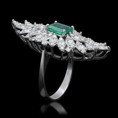 5.35 Carats Natural Emerald and Diamond 14K Solid White Gold Ring Total Natural Green Emerald Weight is: Approx. 2.10 Carats Emerald Measures: Approx. 8.00 x 6.00mm Natural Round Diamonds Weight: Approx. 3.25 Carats (color G-H / Clarity SI1-SI2) Ring total weight: Approx. 7.8 grams Disclaimer: all weights, measurements and colors are approximate and may vary slightly from the listed dimensions or as seen in the image. All pictures are magnified to show the smallest of details. Please, refer to t Luxury Marquise Emerald Ring With Prong Setting, Luxury Marquise Emerald Ring, Luxury Marquise Emerald Ring With Diamonds, Luxury Marquise Multi-stone Diamond Ring, Luxury Platinum Cluster Emerald Ring, Exquisite Multi-stone Diamond Ring In Platinum, Exquisite Multi-stone Platinum Diamond Ring, Luxury Gia Certified Cluster Ring For Formal Occasions, Gia Certified Classic Evening Jewelry