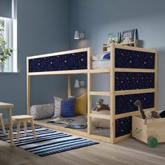 a child's bedroom with bunk beds and toys on the floor in front of it