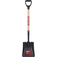 a black shovel with a wooden handle and red lettering on the side, sitting in front of a white background