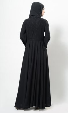 Featuring a beautiful modest wear flared abaya dress in nida basie adorned with self woven floral lace panel covering the top of the bodice and edges of bell style loose sleeves. It has drawstring detailing around the waist and is comfortable to be worn both for informal and formal ocassions.FIT : Relaxed fit.COMPOSITION : Nida.CARE : Dry clean only. Modest Formal Maxi Dress For Eid, Modest Abaya With Modesty Panel For Eid, Solid Color Abaya With Modesty Panel For Eid, Modest Dresses With Modesty Panel For Eid, Elegant Maxi Length Hijab, Elegant Abaya With Modesty Panel, Eid Abaya With Modesty Panel In Solid Color, Elegant Solid Color Abaya With Modesty Panel, Eid Modesty Panel Maxi Abaya